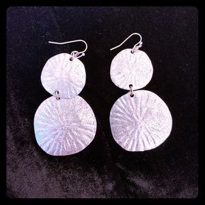 Silver tone sand dollar dangle earrings